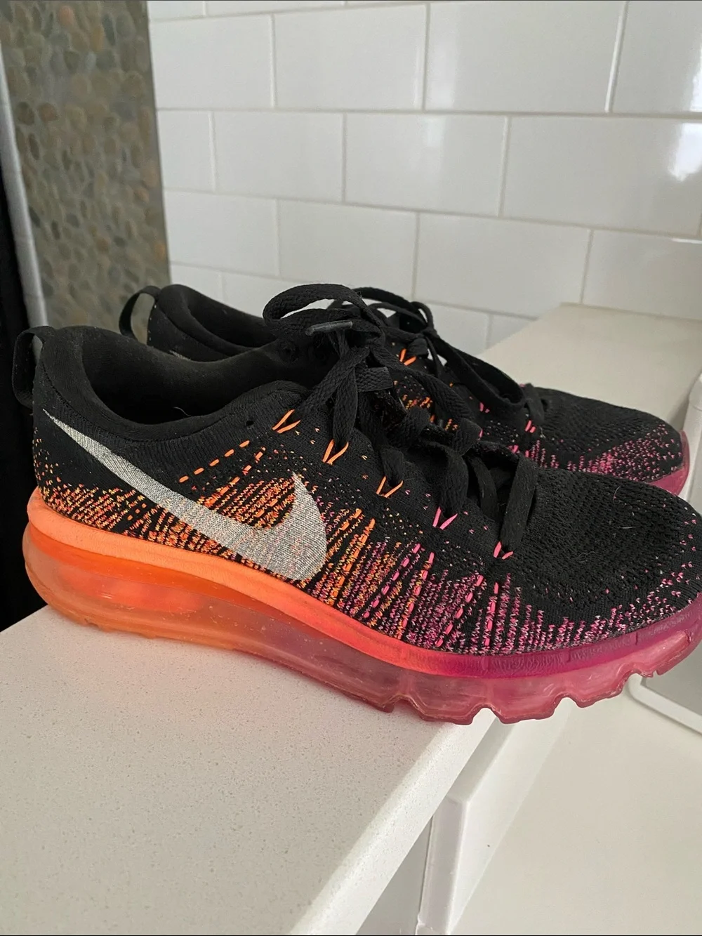 Nike Black Flyknit Running Shoes with Orange and Pink Gradient Sole